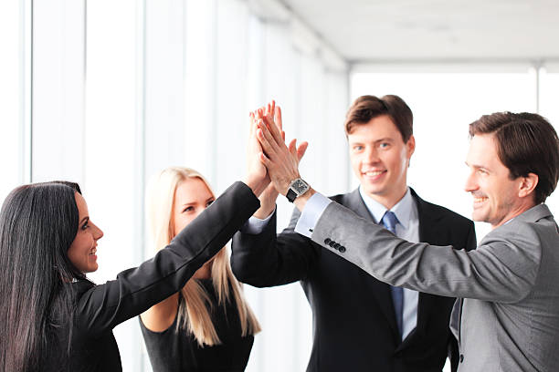 istock Business people giving high five 484444446