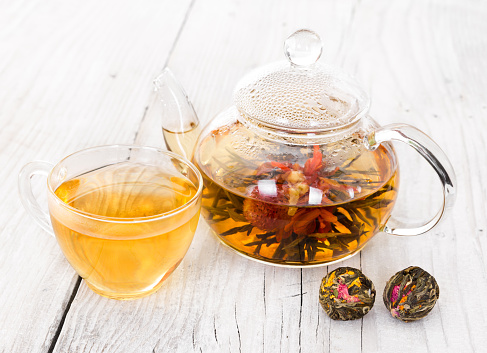 Chinese flowering tea on a wooden background