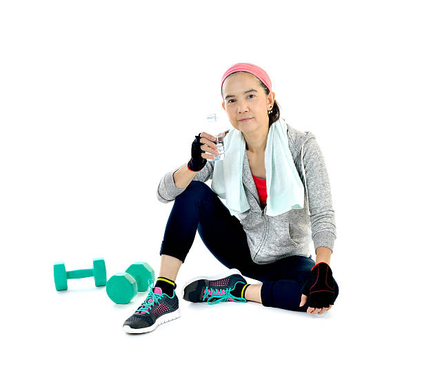 istock Woman with exercise towel and water 484452534