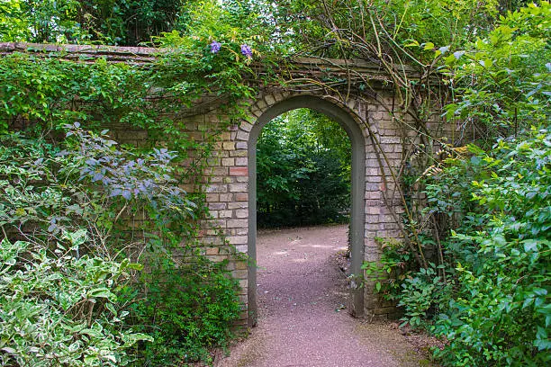 Gate of stone in a formal English garden