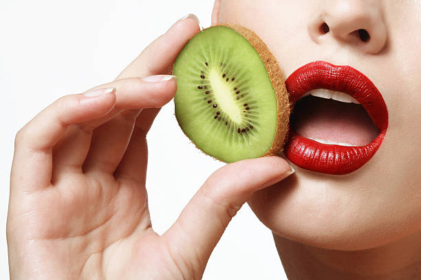 istock kiwi and female lips 484462896