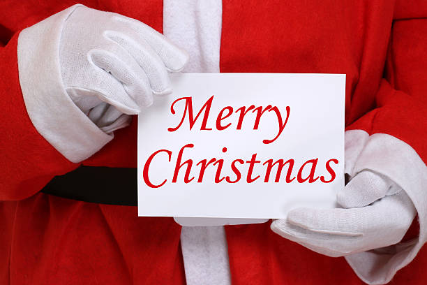 istock Santa Claus holding Merry Christmas card 484463350