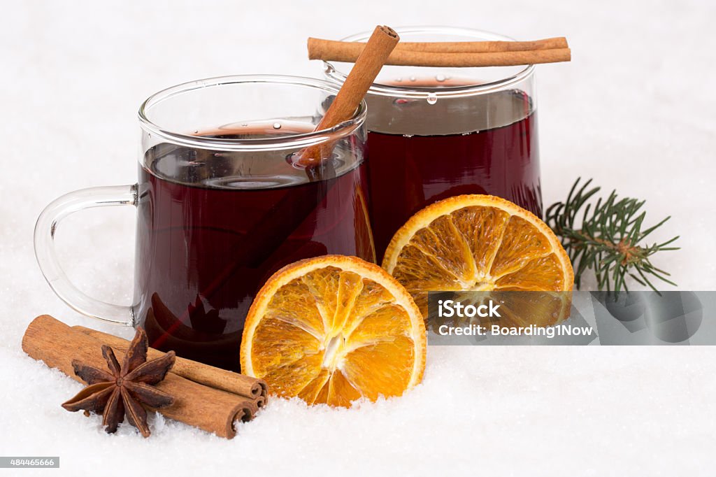 Mulled wine on Christmas in winter alcohol drink in snow Mulled wine drinking on Christmas in winter alcohol drink in snow Mulled Wine Stock Photo