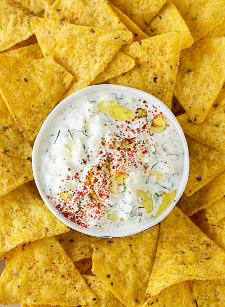 istock Tortilla chips and cream sauce with fresh herbs, garlic 484466128