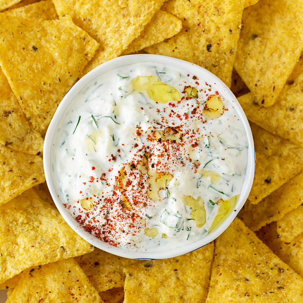 istock Tortilla chips and cream sauce with fresh herbs, garlic 484466310