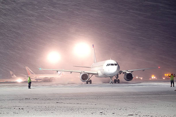 istock plane parked at the airport in winter 484467868