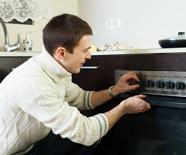 istock Guy cooking something in the oven 484468371