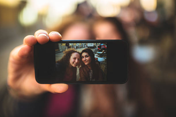 istock Couple of friends doing a selfie 484470213