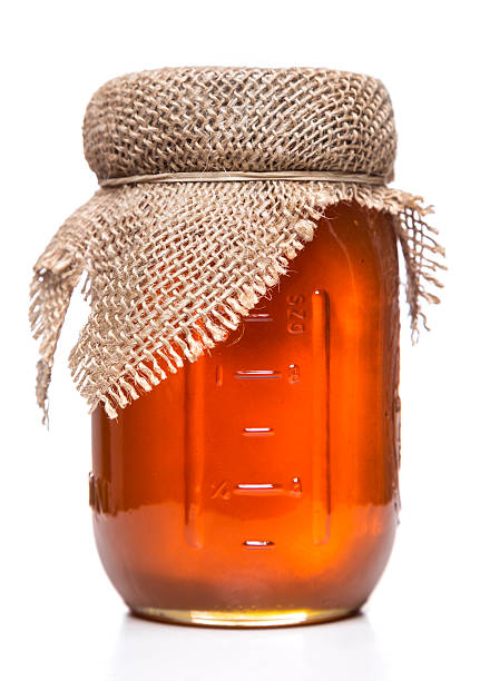 istock pure and raw honey jar 484470289