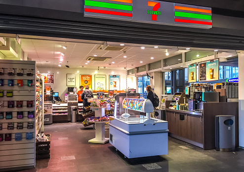 Oslo, Norway - July 19, 2015: 7 Eleven Store inside Oslo Central Train Station, Norway. Few customers inside the store. 