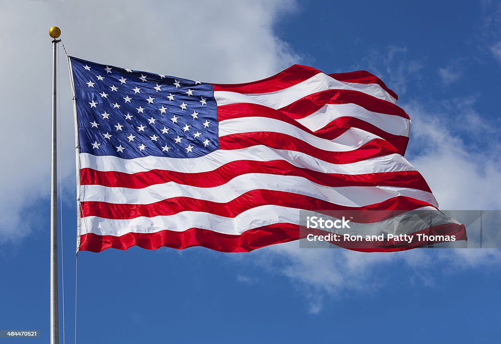 American flag against the sky American Flag Stock Photo