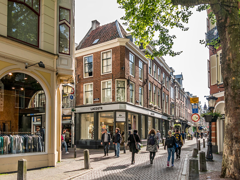 Utrecht, Netherlands - May 21, 2015: People walking in shopping streets Lijnmarkt and Zadelstraat in the city centre on a sunny afternoon