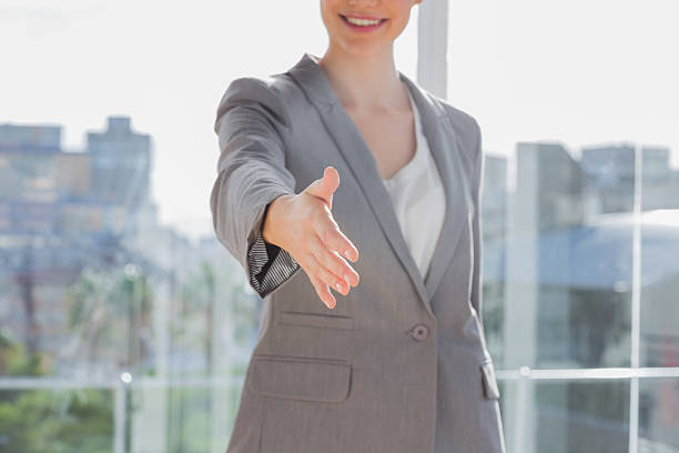 istock Businesswoman offering hand for handshake 484470905