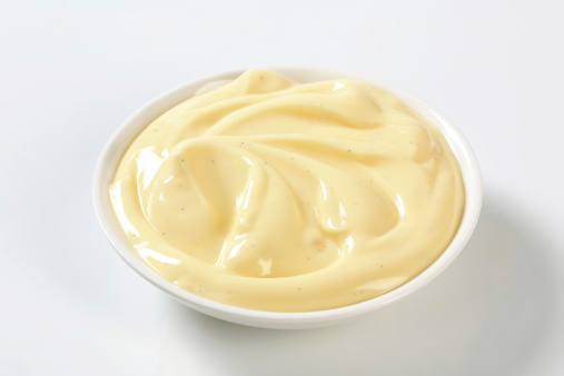 smooth vanilla cream in a white bowl