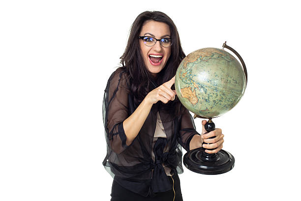 istock Young woman with globe on isolated background 484471493