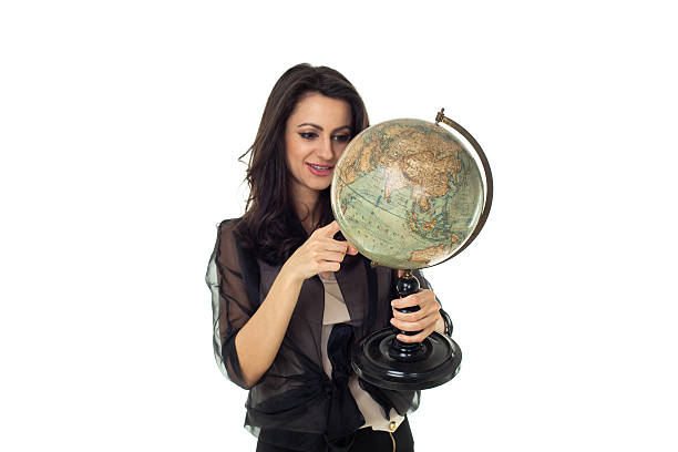 istock Young woman with globe on isolated background 484471509