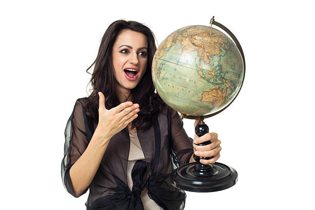 istock Young woman with globe on isolated background 484471533