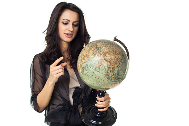 istock Young woman with globe on isolated background 484471575