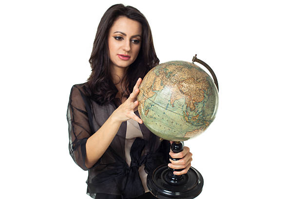 istock Young woman with globe on isolated background 484471585