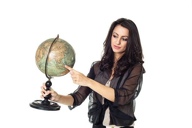 istock Young woman with globe on isolated background 484471855