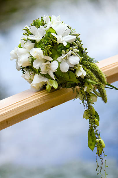 wedding bouquet on bridge stock photo