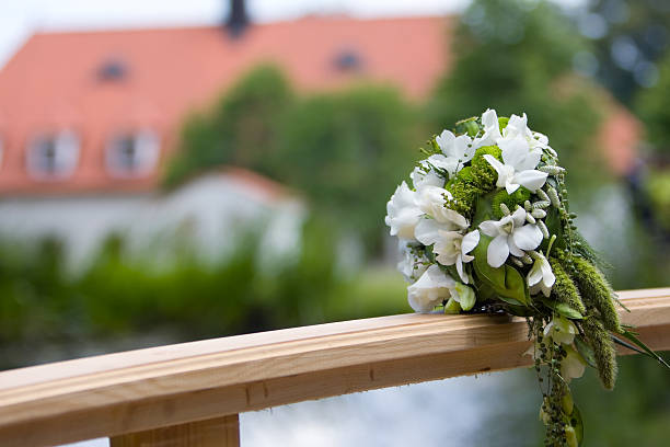 wedding bouquet on bridge stock photo