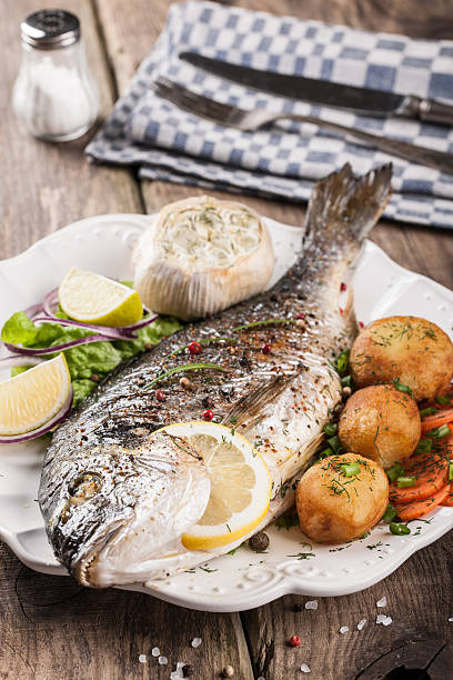 istock Baked fish dorado with vegetables 484473044