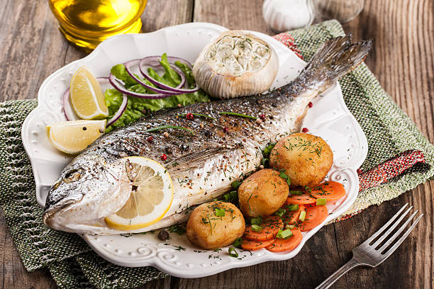 istock Baked fish dorado with vegetables 484473154