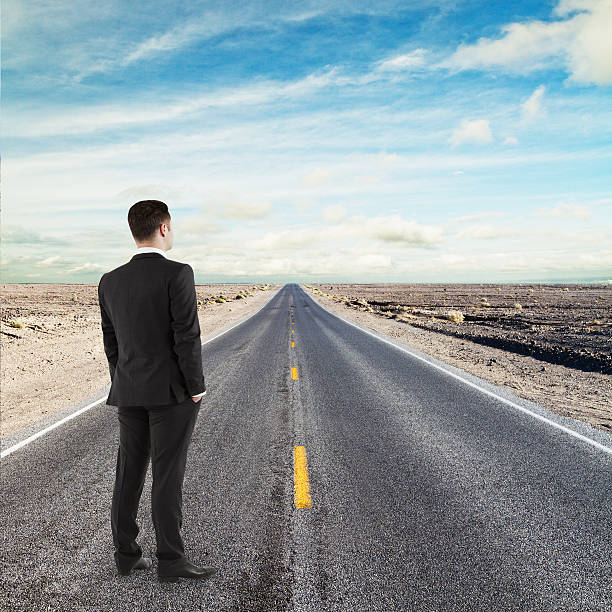 istock businessman standing on road 484473163