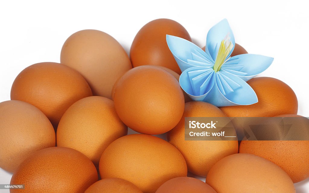 Easter eggs on the plate with a paper flower Adult Stock Photo