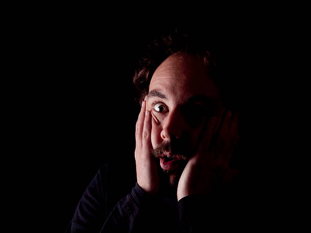 istock Low key image of a bearded man with shocked expression 484475171
