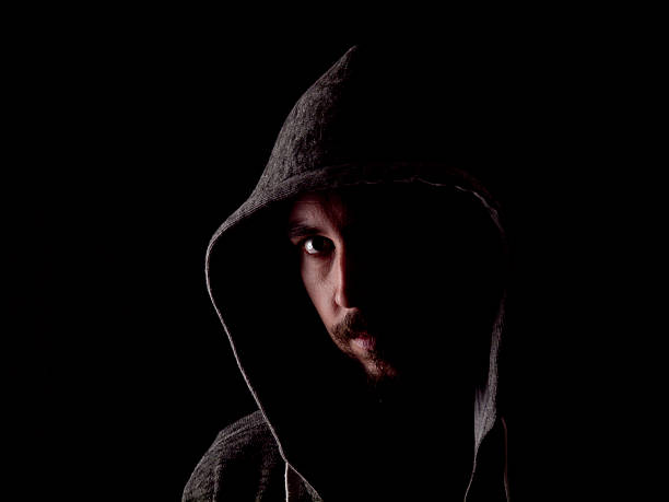 istock Low key image of a bearded man with hoody 484475181