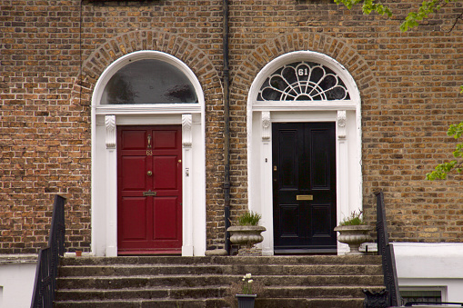 Dublin,Ireland-April 27, 2010 : A view of the red and black doors of the Irish houses at Dublin city center in spring.