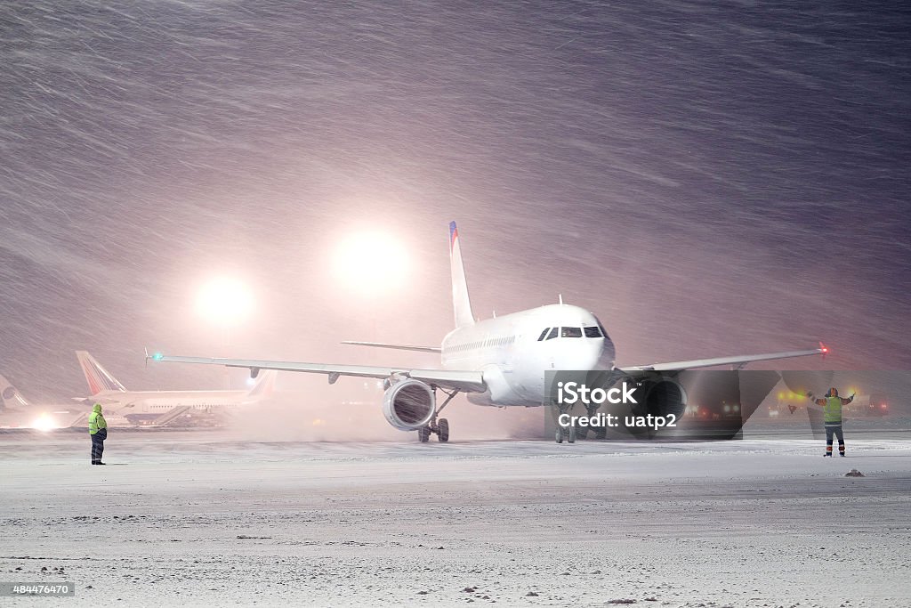 plane parked at the airport in winter Moscow, Russia, February, 09,2015: plane parked at the airport in winter Airplane Stock Photo