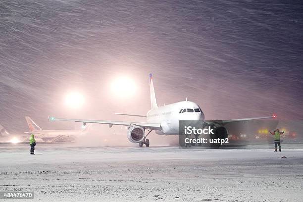 Plane Parked At The Airport In Winter Stock Photo - Download Image Now - Airplane, Airport, Snow