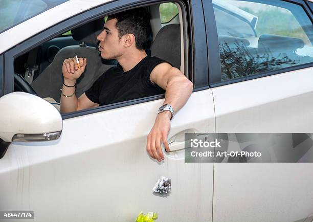 Man Tossing Litter From Open Car Window Stock Photo - Download Image Now - Car, Window, Garbage