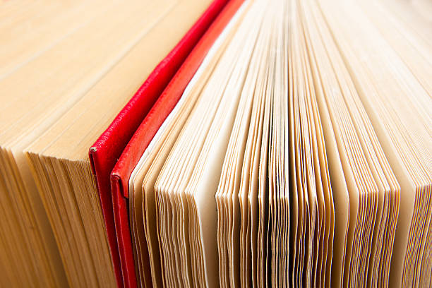 istock Top view of old used colorful hardback books. 484484312