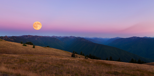 The full Moon is very spectacular over Olympic mountains.