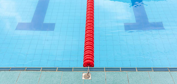 istock The red marked lane in center of platform for competition. 484487556
