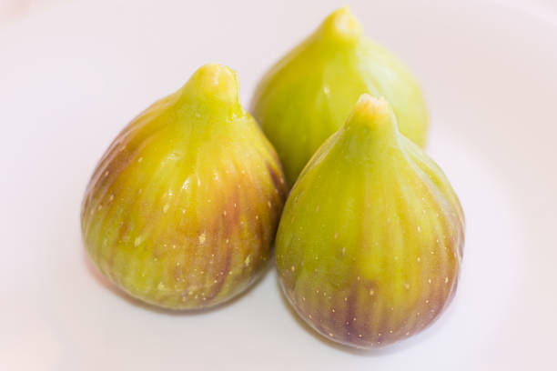 Three figs on white