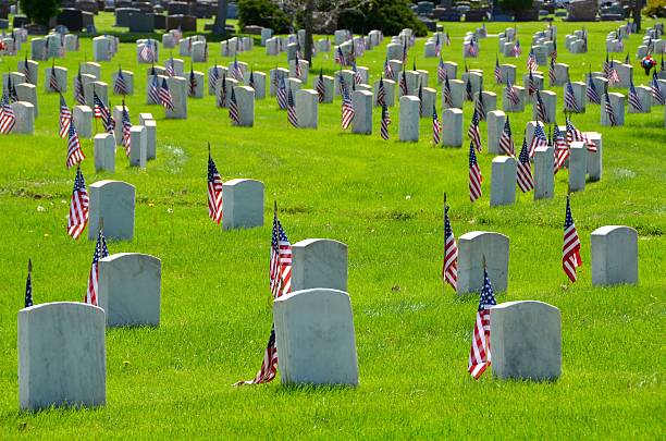 istock Memorial Day Headstones with American Flags 484491280