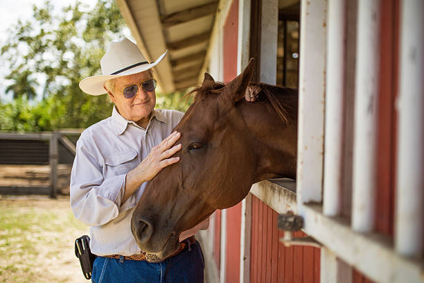 istock Senior and his horse 484494470
