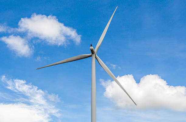 istock From behind of wind turbine in beautiful cloudy blue sky. 484496312