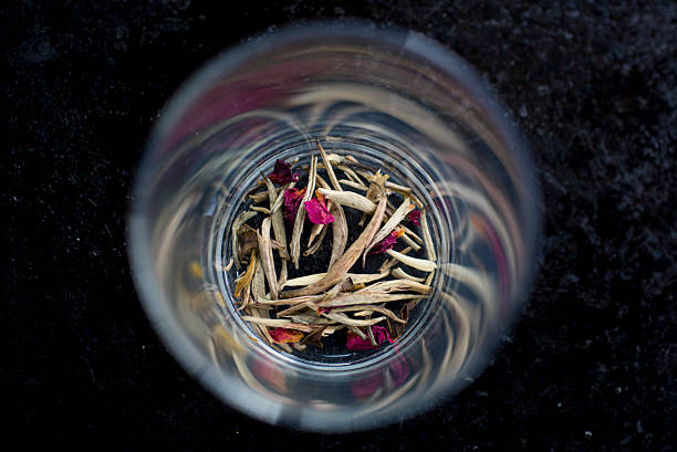 istock Green rose tea leaves in a glass 484499368