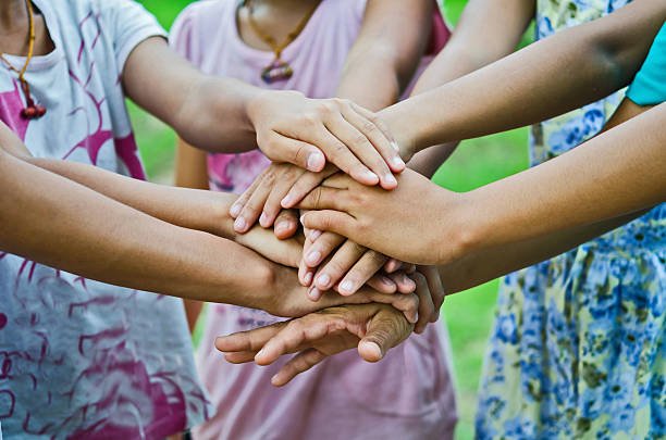 istock group of young people's hands 484502518