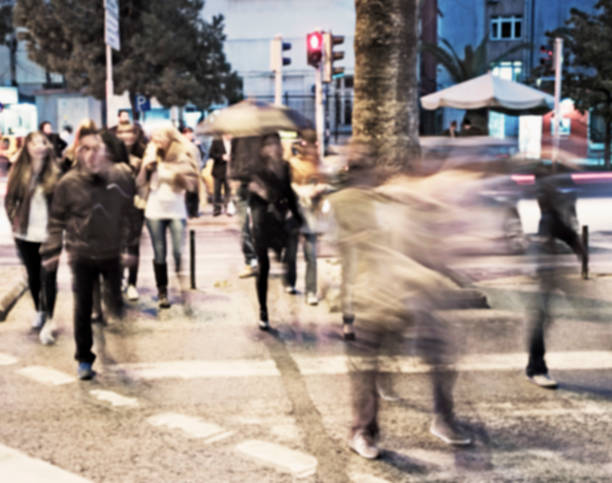 istock Defocused people crossing the street. 484502756