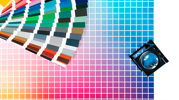 istock Charts with cmyk printing colors and magnifying glass 484503674