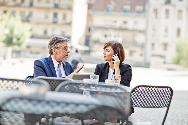 istock business coworkers using a tablet at the cafe 484504016