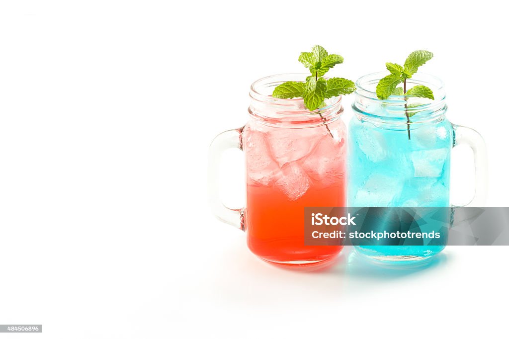 refreshing summer drinks in jar refreshing summer drinks in jar with ice and mint on a white background 2015 Stock Photo