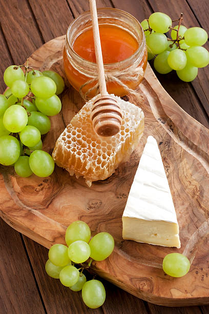 istock Still life with cheese, grape and honey 484511238